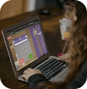 Child at laptop taking an online learning class for school